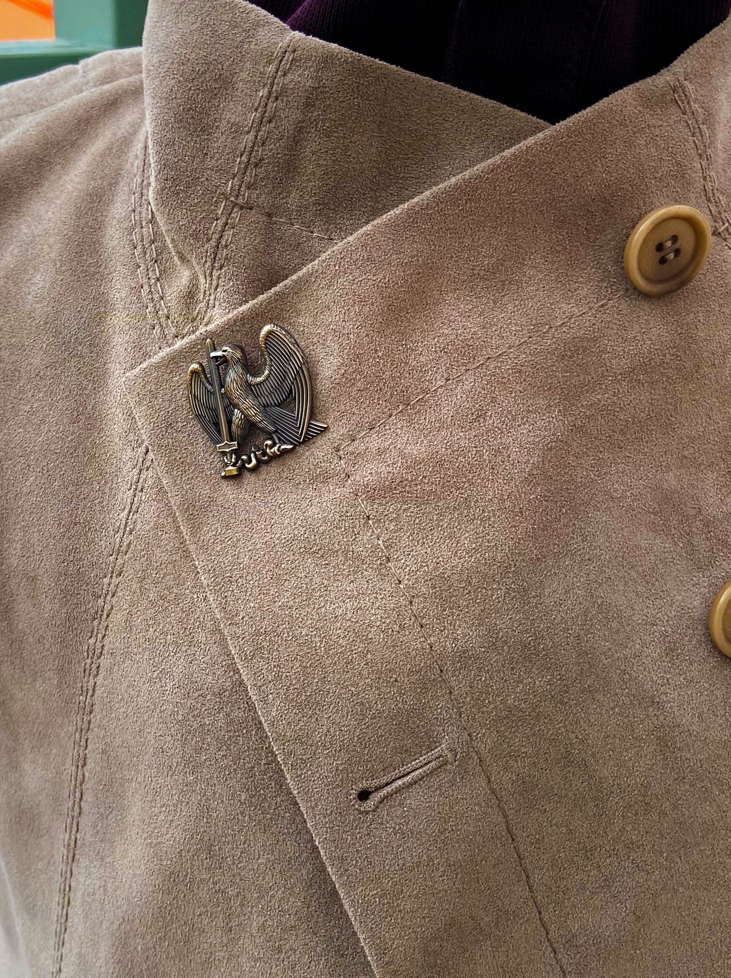 Eagle of Taron lapel pin on jacket